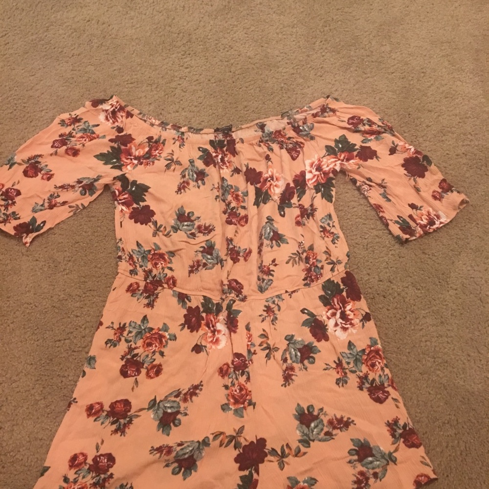 Off the shoulder pink and floral romper.